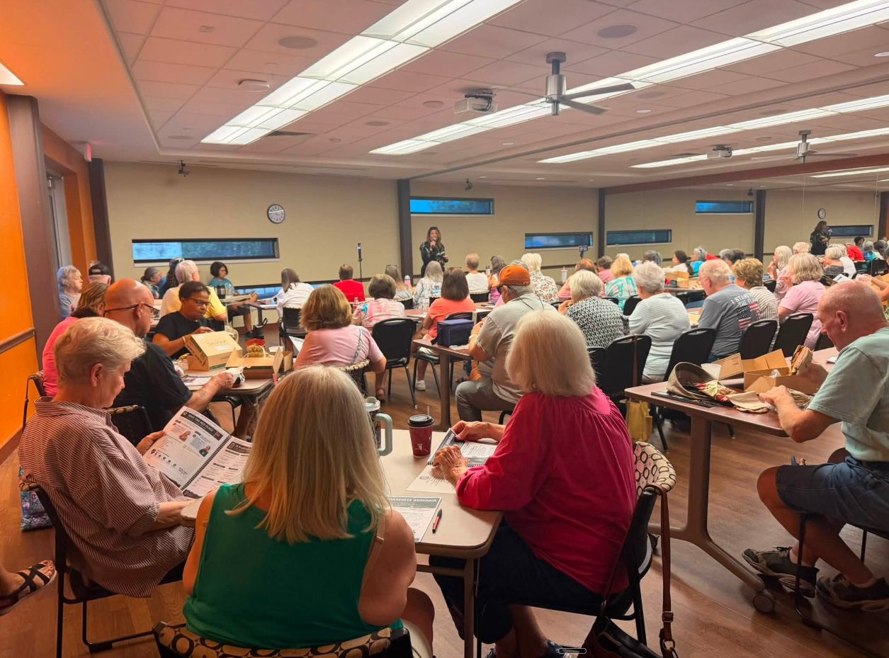 A full room of seniors attending a Silver Streak fraud-awareness workshop.