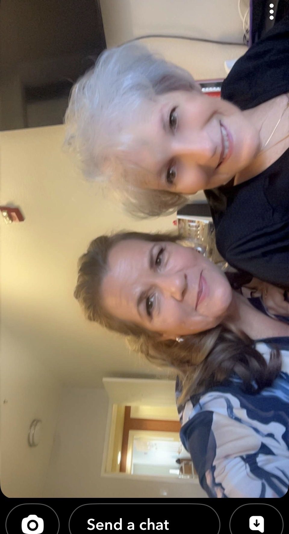 Sherri L. Combs standing with Carol, a workshop attendee, at a community event.